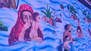 মণ্ডপের দেয়ালে দেয়ালে মানবতার চিত্র