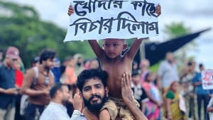 ‘খোদার কাছে বিচার দিলাম’, প্ল্যাকার্ড হাতে শিশুর প্রতিবাদ